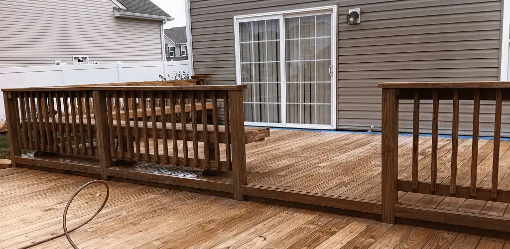 Deck sealing service protecting a backyard wood deck and railings in Boise, ID