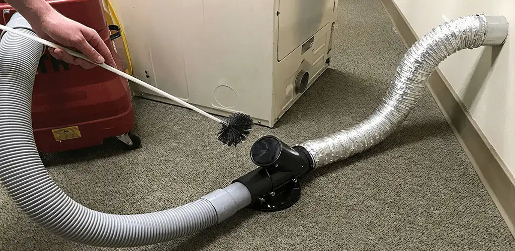 Dryer vent cleaning service removing lint from a dryer duct connection in Boise, ID